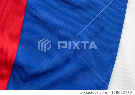 White blue and red sports clothing fabric football shirt jersey texture background White blue and red sports clothing fabric football shirt jersey texture background 129652770