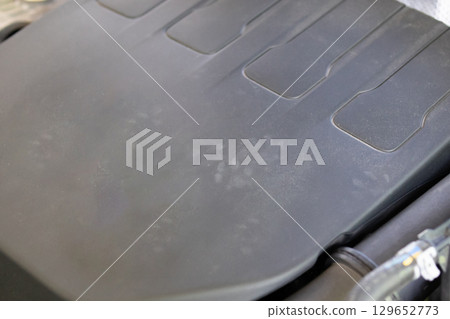 Rat footprint in the car engine 129652773