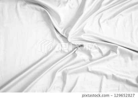 Abstract white wrinkled bedding sheet fabric texture background 129652827