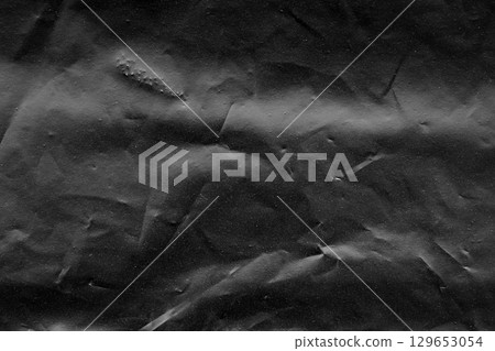 Black plastic bag surface texture background 129653054