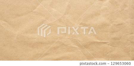 Abstract crumpled and creased recycle brown paper texture background Abstract crumpled and creased recycle brown paper texture background 129653060