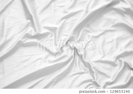 Abstract white wrinkled bedding sheet fabric texture background Abstract white wrinkled bedding sheet fabric texture background 129653140