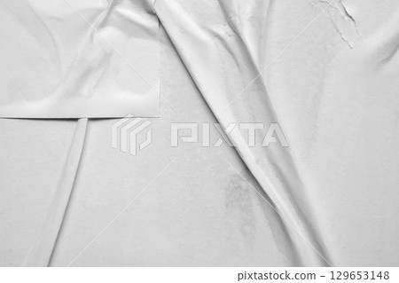 white crumpled and creased glued wrinkled paper poster texture background white crumpled and creased glued wrinkled paper poster texture background 129653148