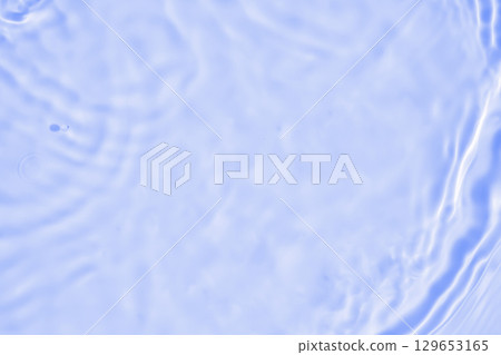 Abstract transparent water shadow surface texture natural ripple on blue background Abstract transparent water shadow surface texture natural ripple on blue background 129653165