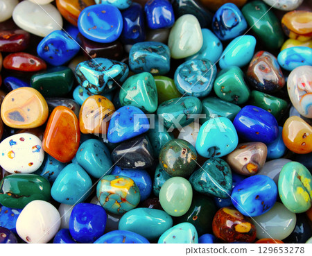 Miniature art of handmade painted rocks showcasing craft and creativity 129653278