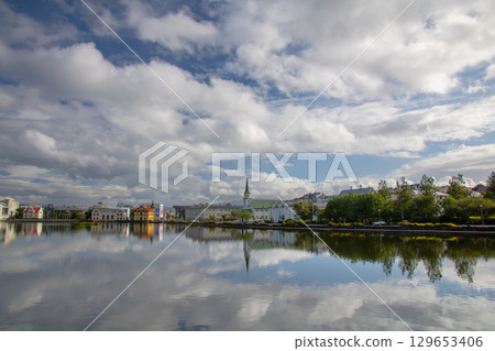 The mirror-like surface of Lake Tjörnin in the capital Reykjavik, Iceland, a Nordic island nation The mirror-like surface of Lake Tjörnin in the capital Reykjavik, Iceland, a Nordic island nation 129653406