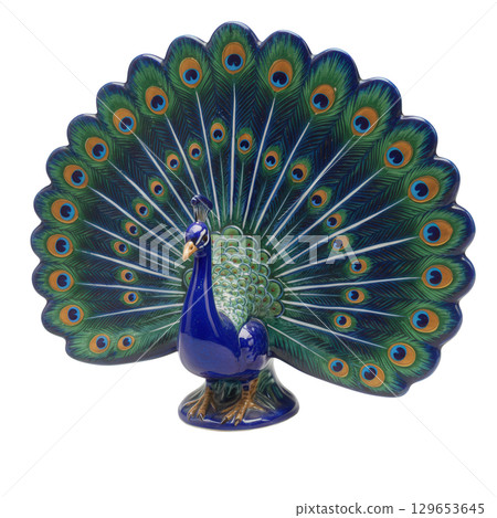 Colorful ceramic peacock statuette with its beautiful tail fully fanned out in bright blue 129653645