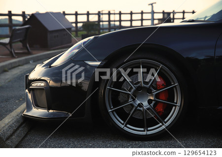A shiny black sports car A shiny black sports car 129654123