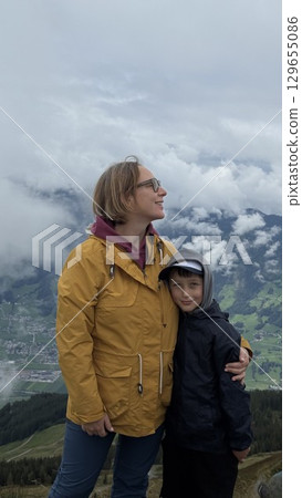 Mother and Son Enjoy Scenic Mountain View Together 129655086