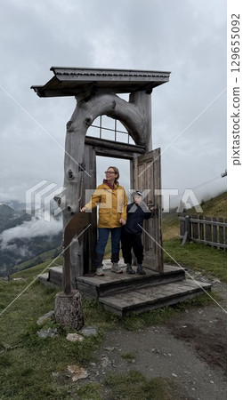 Mother and Son Enter Doorway to Eternity on Mountain Mother and Son Enter Doorway to Eternity on Mountain 129655092