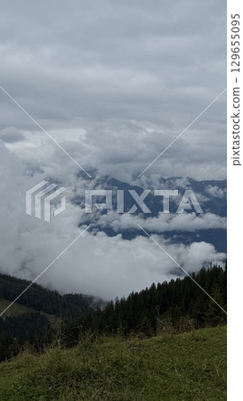 Dramatic Mountain View with Clouds from the Summit Dramatic Mountain View with Clouds from the Summit 129655095