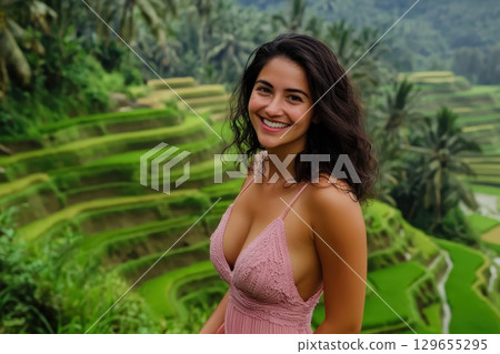 beautiful woman in tropical garden 129655295