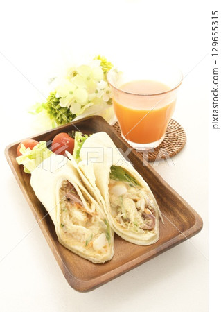Roast beef tortilla and carrot juice Roast beef tortilla and carrot juice 129655315