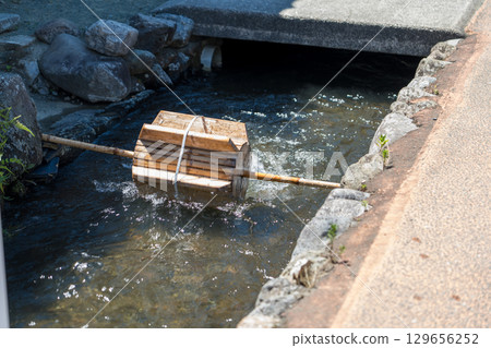 Waterwheel on a stream 129656252