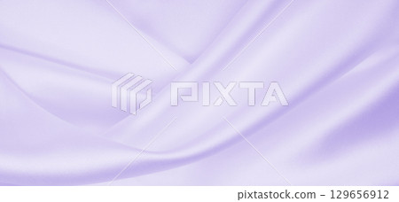 Smooth elegant lilac silk or satin texture as wedding background. Luxurious valentine day background design 129656912