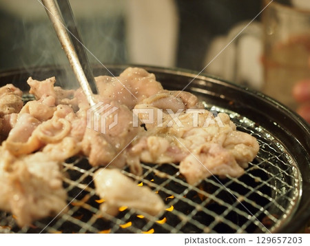 Meat grilled on a barbecue 129657203