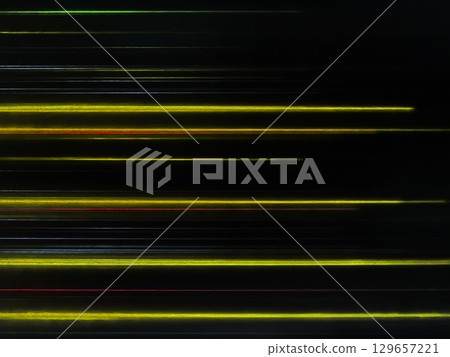 A black background image with many thin rays of light, such as yellow, arranged in straight lines. A black background image with many thin rays of light, such as yellow, arranged in straight lines. 129657221