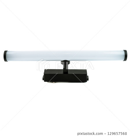 Modern horizontal LED light fixture with sleek black base and long tubular design, ideal for interior lighting, isolated on white background. 129657568