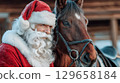 Santa Claus with a horse, symbol of 2026, sharing festive winter holiday spirit 129658184