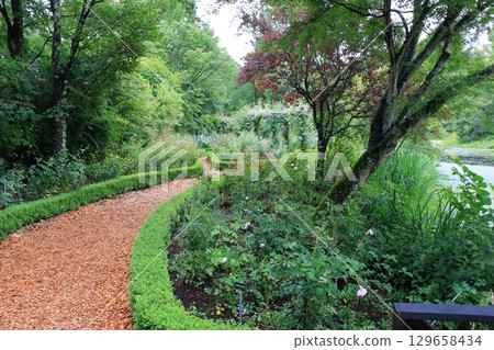 The paths around the lake and gardens of the Lake Garden in the Japanese resort town of Karuizawa in the Nagano Alps. The paths around the lake and gardens of the Lake Garden in the Japanese resort town of Karuizawa in the Nagano Alps. 129658434