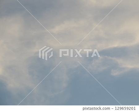 Clouds rising in the blue sky 129659201