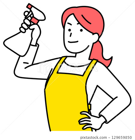 A woman in an apron holding a spray detergent 129659850