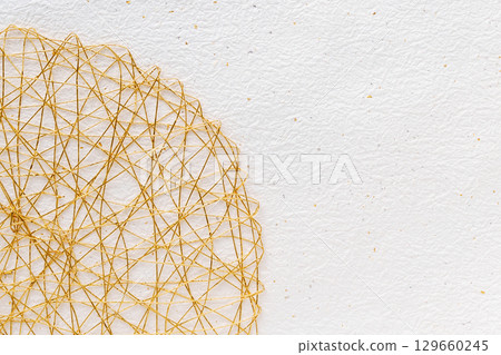 Background of white fir Japanese paper and gold Mizuhiki with gold and silver foil 129660245