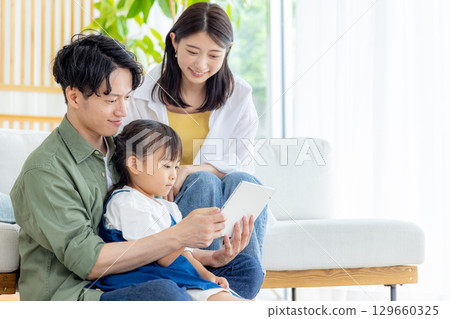 Young family, parent and child, girl, smiling Young family, parent and child, girl, smiling 129660325