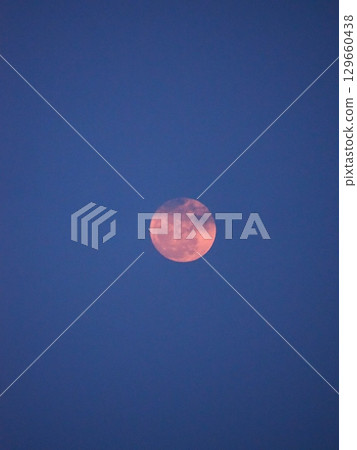 The moon reminds us that it is a celestial body 129660438