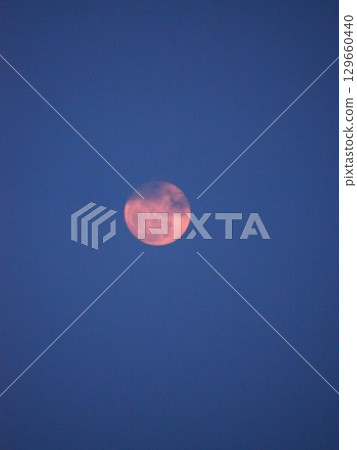 The moon reminds us that it is a celestial body 129660440