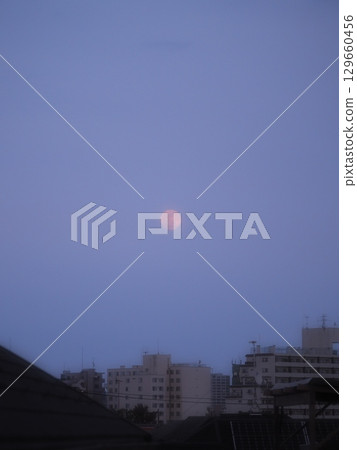 The moon reminds us that it is a celestial body 129660456