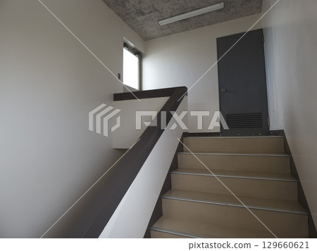Old-fashioned apartment stairs and landing Old-fashioned apartment stairs and landing 129660621