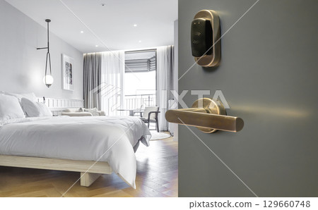 Opened door of hotel room with bedroom background Opened door of hotel room with bedroom background 129660748