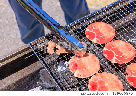 Beef tongue grilled on a barbecue grill 129660879