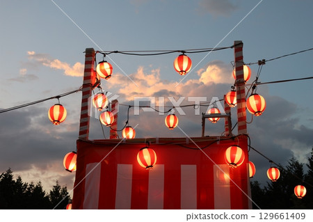 Bon dance lanterns lit at dusk Bon dance lanterns lit at dusk 129661409
