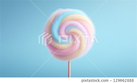 Front view of a cute pastel colored cotton candy stick with a swirl pattern placed on a light blue background 129662888