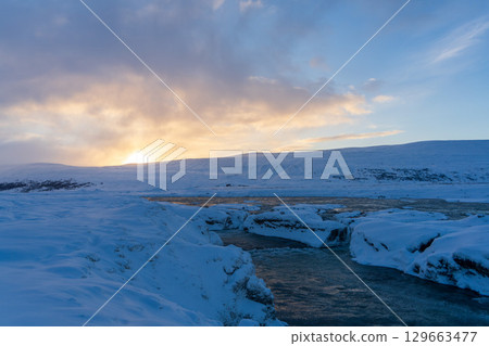 Skjálfandafljót River in winter at sunset (Iceland) 129663477