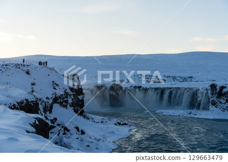 Snow-covered Godafoss Waterfall in winter (Iceland) Snow-covered Godafoss Waterfall in winter (Iceland) 129663479