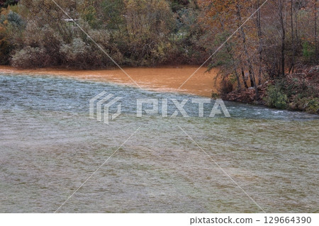 Confluence contrasting rivers. confluence of river unusual nature amazing lands autumn. High quality photo 129664390