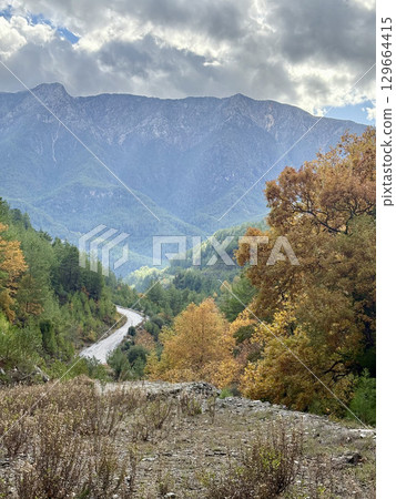 Mountainous road sky. Cloudy road landscape. High quality photo 129664415