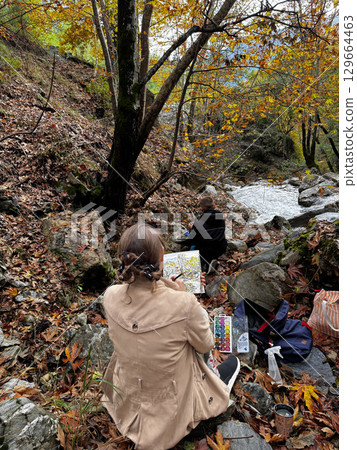 artist outdoors landscape autumn trees. High quality photo 129664463
