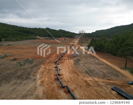 metal pipes lay gas in the mountains. High quality photo metal pipes lay gas in the mountains. High quality photo 129664540