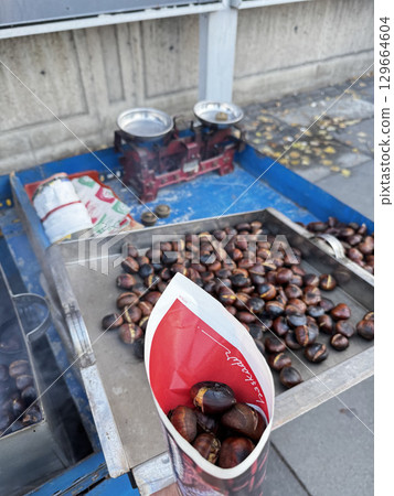 roasted chestnuts on a street stall. High quality photo 129664604