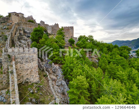 Rocky cliff castle Tower seaside ruins Ancient stone ruins. High quality photo 129664646