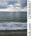 Sunset ocean waves. Sunset ocean horizon. High quality 4k footage 129664667