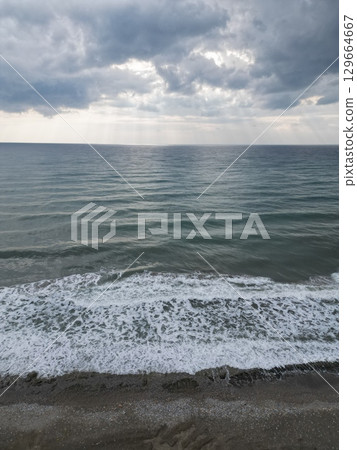 Sunset ocean waves. Sunset ocean horizon. High quality 4k footage 129664667