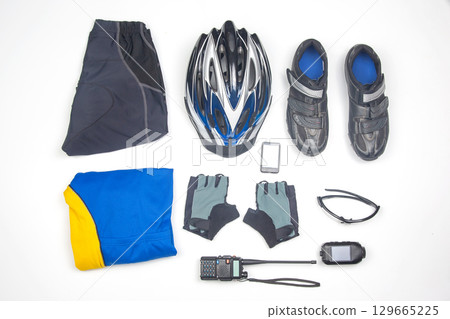 Cycling gear and equipment laid out on a clean surface for biking enthusiasts before a ride Cycling gear and equipment laid out on a clean surface for biking enthusiasts before a ride 129665225