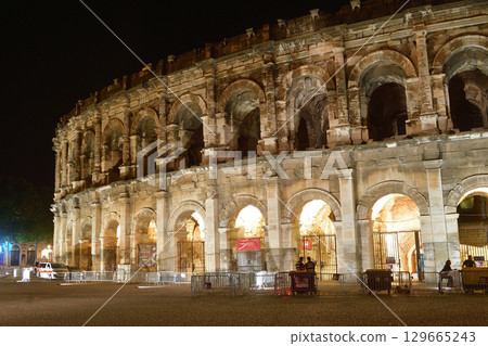 Nîmes, France. Night view of the Roman Amphitheater on August 12, 2025. Nîmes, France. Night view of the Roman Amphitheater on August 12, 2025. 129665243