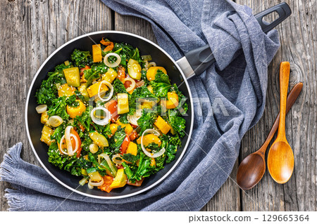 zucchini kale tomato saute sprinkled with sesame 129665364