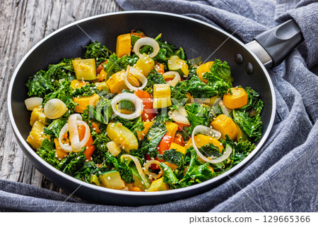zucchini kale tomato saute sprinkled with sesame 129665366